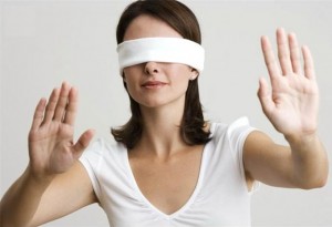 Blindfolded Woman with Arms Raised